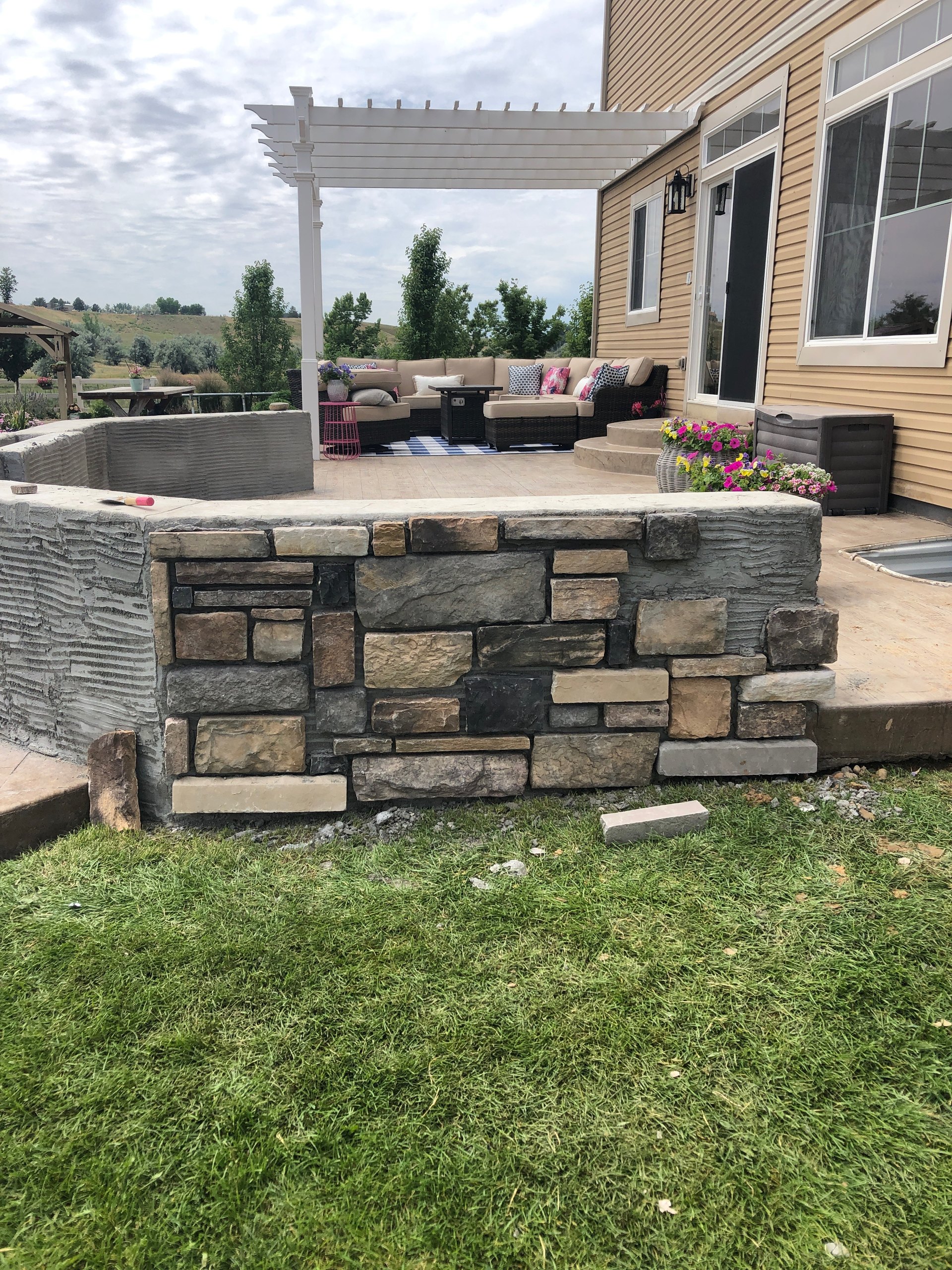 Stone patio wall construction